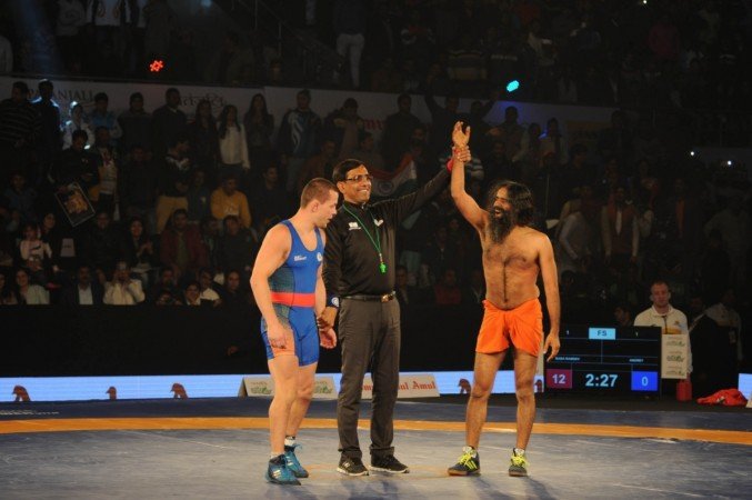See How Baba Ramdev shows his power of yoga Wrestling League